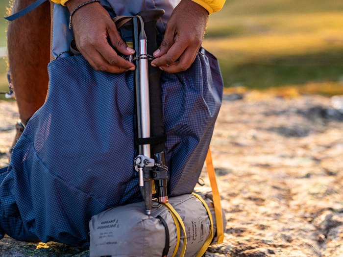 man tightens straps on one of the best backpacks in our list